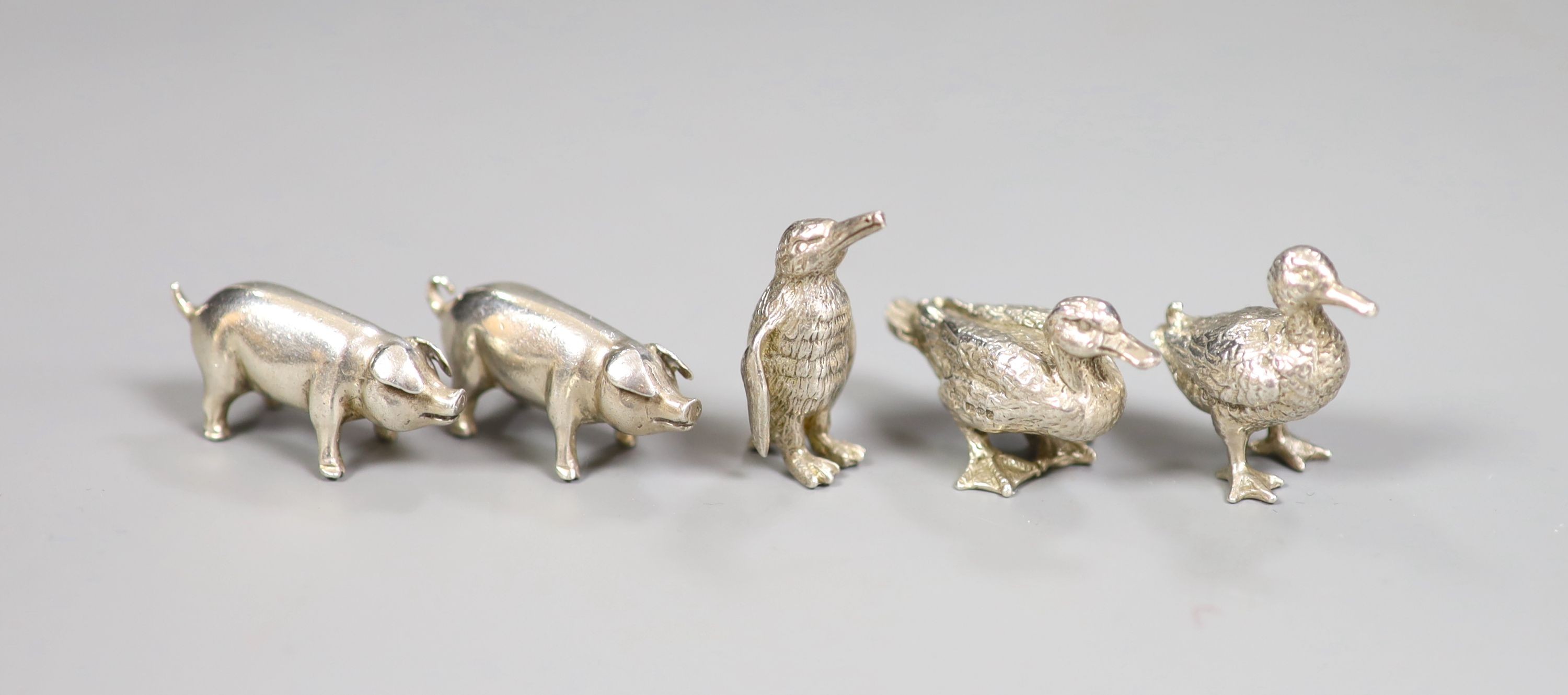 Five modern miniature silver model animals including two pigs by Simon J Beer, London, 1991, two ducks and a penguin, tallest 3cm, 87 grams.